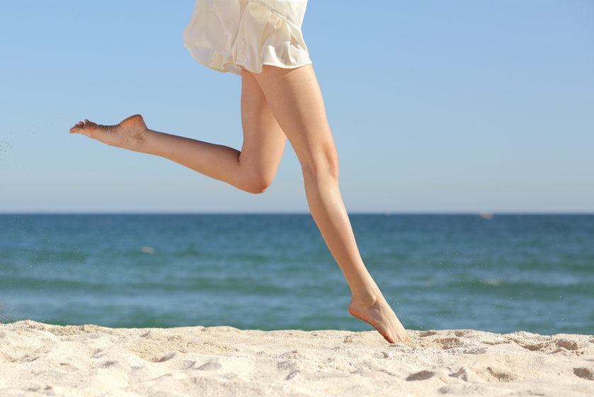 Woman running on a beach